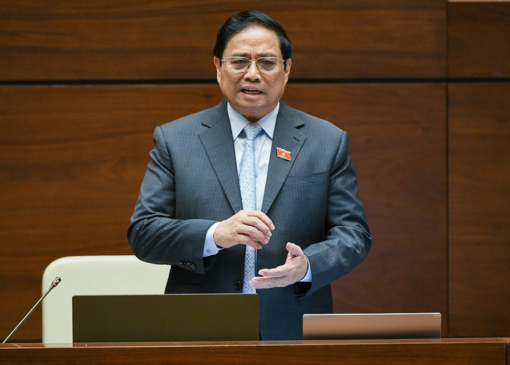 Thủ tướng Chính phủ Phạm Minh Chính báo cáo giải trình và trả lời chất vấn trước Quốc hội. Ảnh: Quochoi.vn